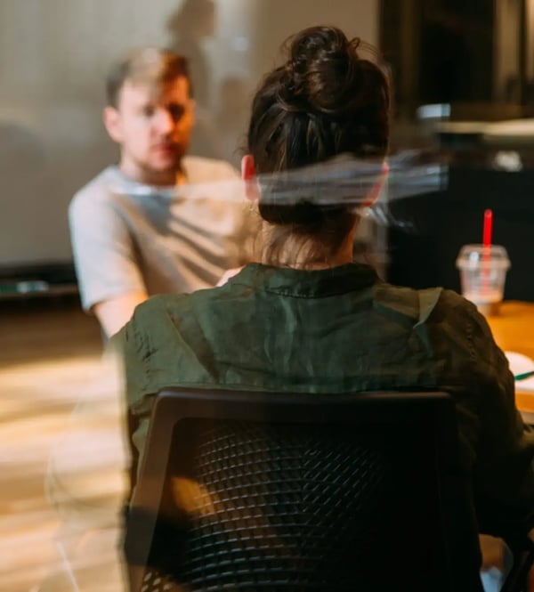Time to Fill: job interview between two people at a meeting table in an office