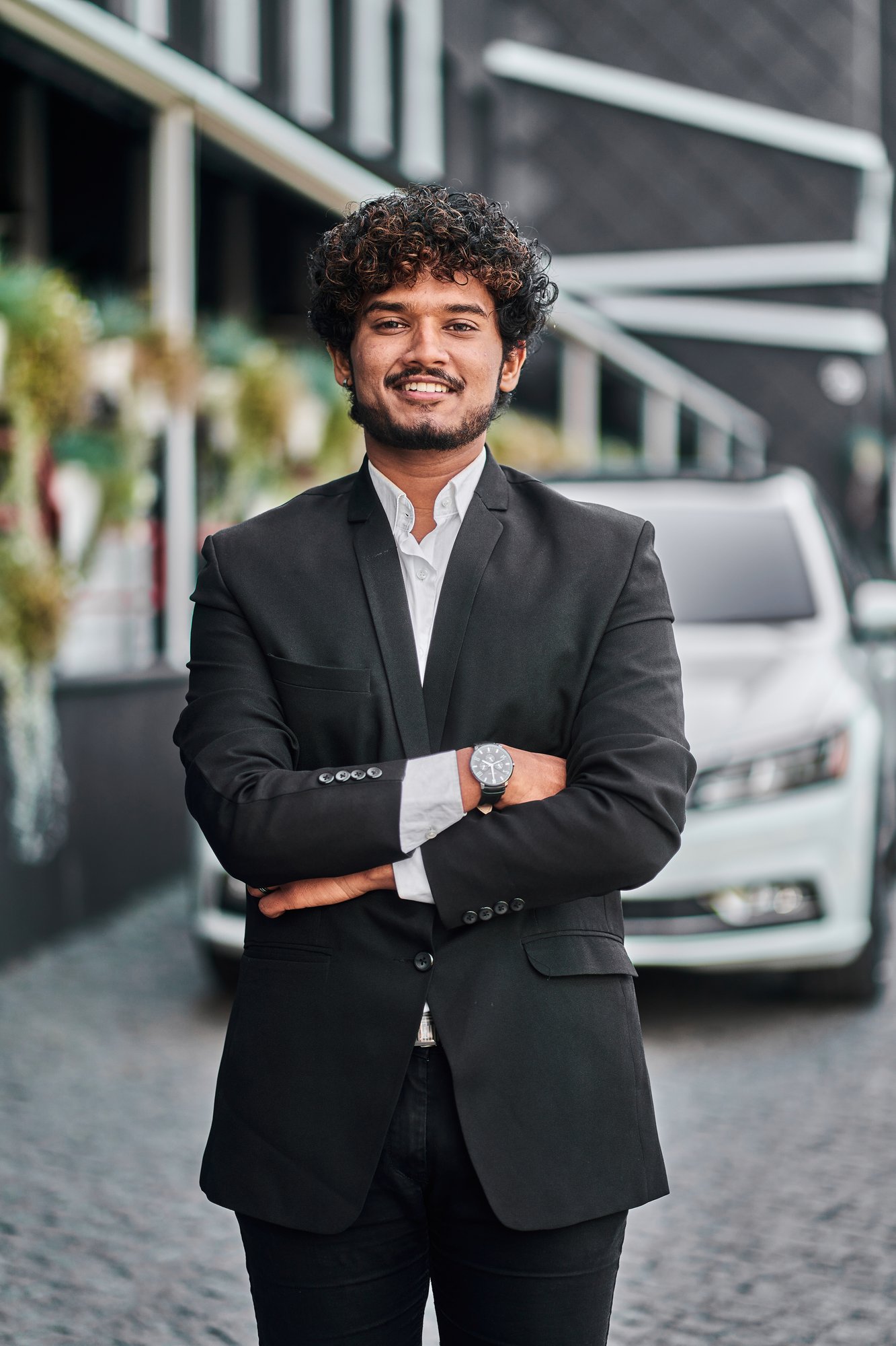 indian-businessman-with-his-white-car
