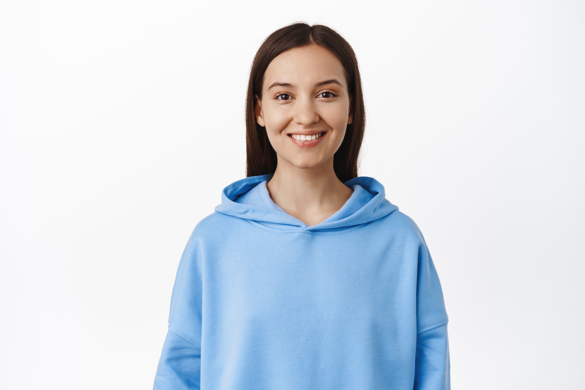 portrait-young-brunette-20s-woman-wearing-blue-hoodie-smiling-white-teeth-looking-happy-standing-against-white-background