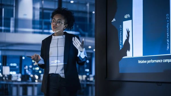 Strategic orientation in companies: Manager presenting in front of data screens